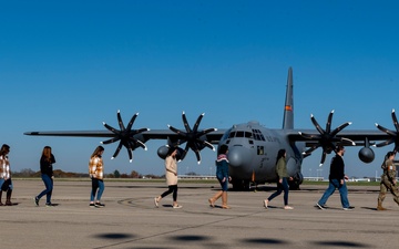 Spouses of members of the 182nd Operations Group fly on a C-130H3