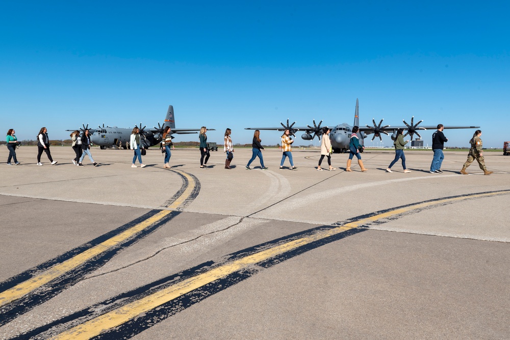 Spouses of members of the 182nd Operations Group fly on a C-130H3