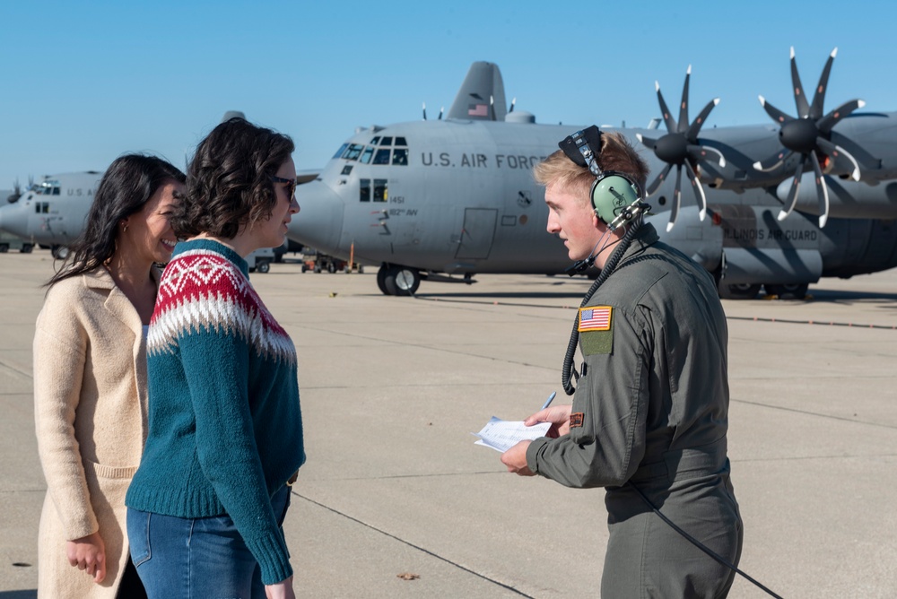 Spouses of members of the 182nd Operations Group fly on a C-130H3