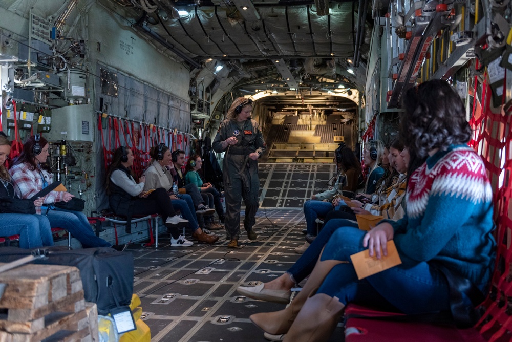 Spouses of members of the 182nd Operations Group fly on a C-130H3