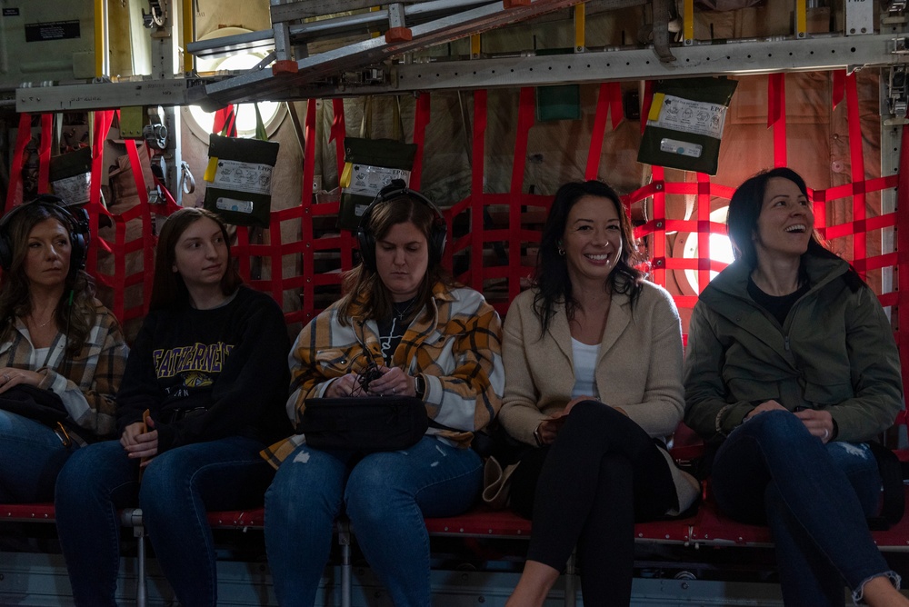 Spouses of members of the 182nd Operations Group fly on a C-130H3