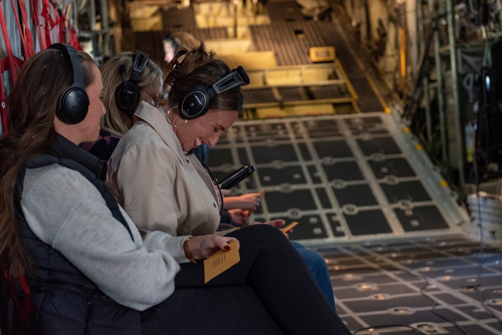 Spouses of members of the 182nd Operations Group fly on a C-130H3