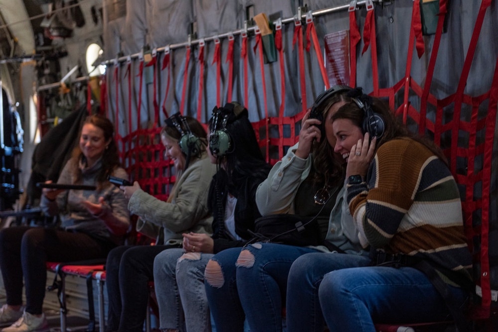 Spouses of members of the 182nd Operations Group fly on a C-130H3