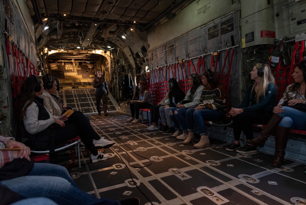 Spouses of members of the 182nd Operations Group fly on a C-130H3