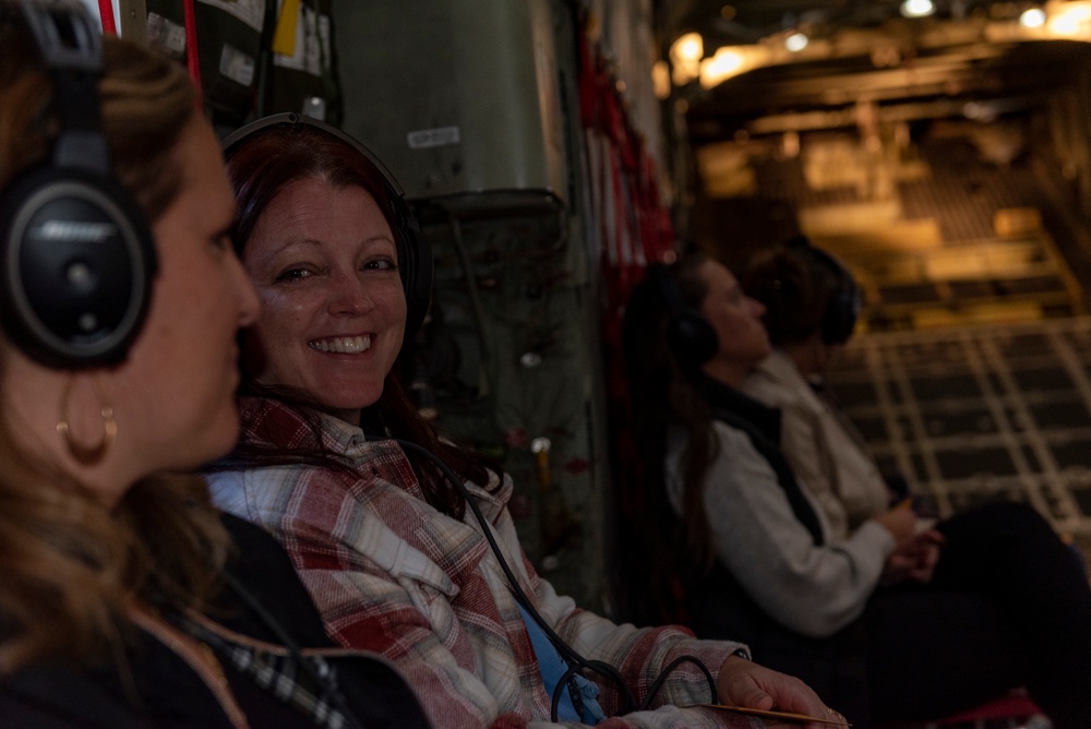 Spouses of members of the 182nd Operations Group fly on a C-130H3