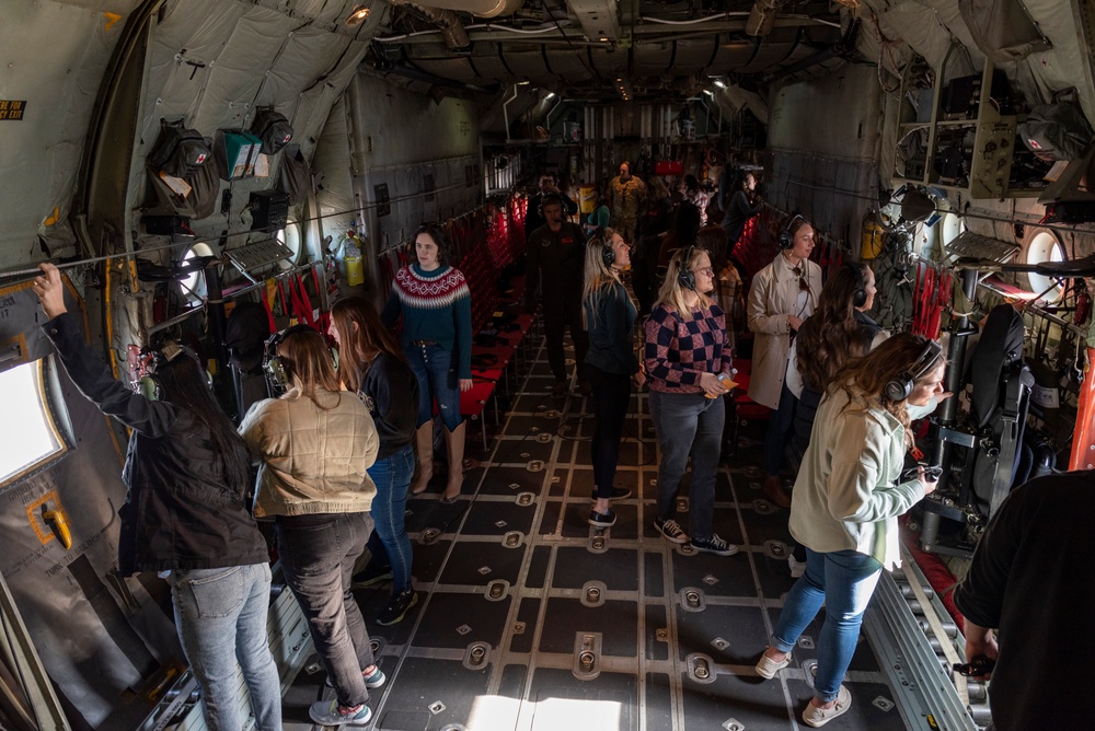 Spouses of members of the 182nd Operations Group fly on a C-130H3