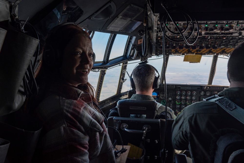 Spouses of members of the 182nd Operations Group fly on a C-130H3