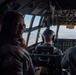 Spouses of members of the 182nd Operations Group fly on a C-130H3