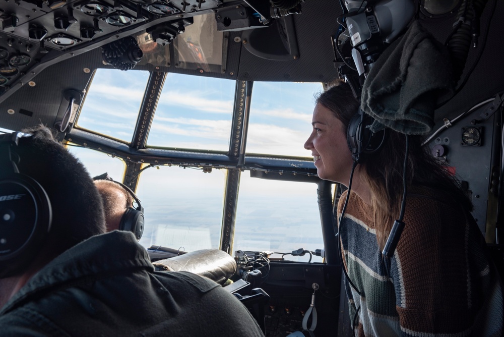 Spouses of members of the 182nd Operations Group fly on a C-130H3