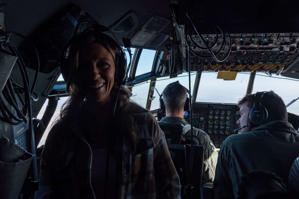 Spouses of members of the 182nd Operations Group fly on a C-130H3