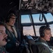 Spouses of members of the 182nd Operations Group fly on a C-130H3