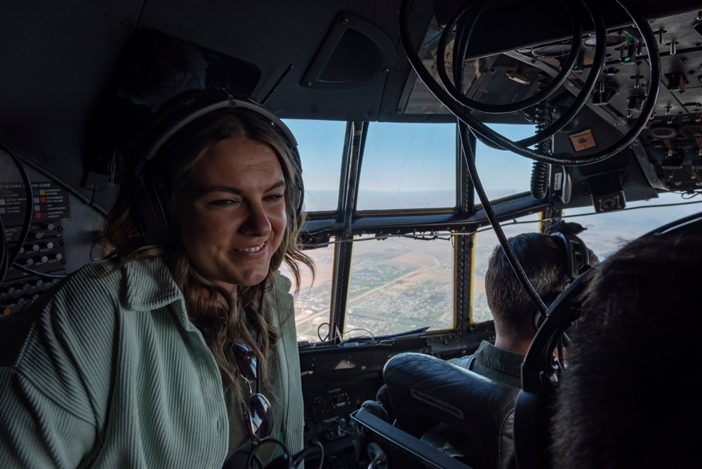 Spouses of members of the 182nd Operations Group fly on a C-130H3