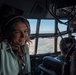 Spouses of members of the 182nd Operations Group fly on a C-130H3