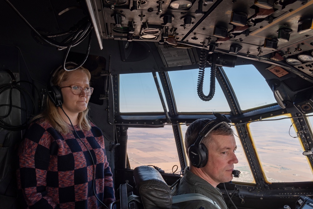 Spouses of members of the 182nd Operations Group fly on a C-130H3