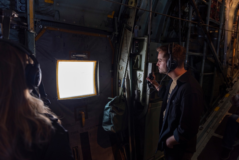 Spouses of members of the 182nd Operations Group fly on a C-130H3