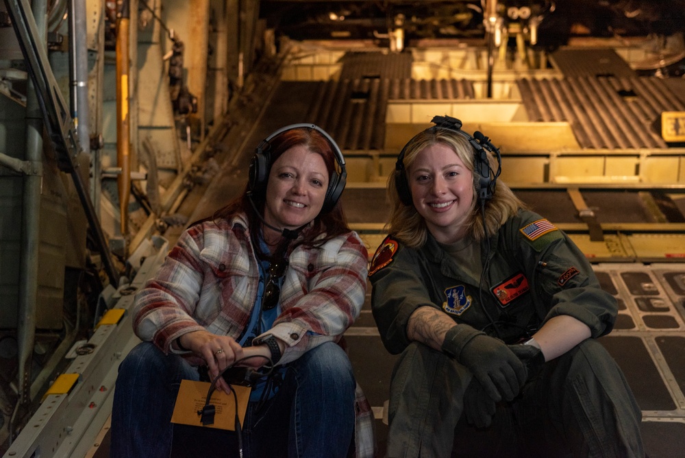 Spouses of members of the 182nd Operations Group fly on a C-130H3