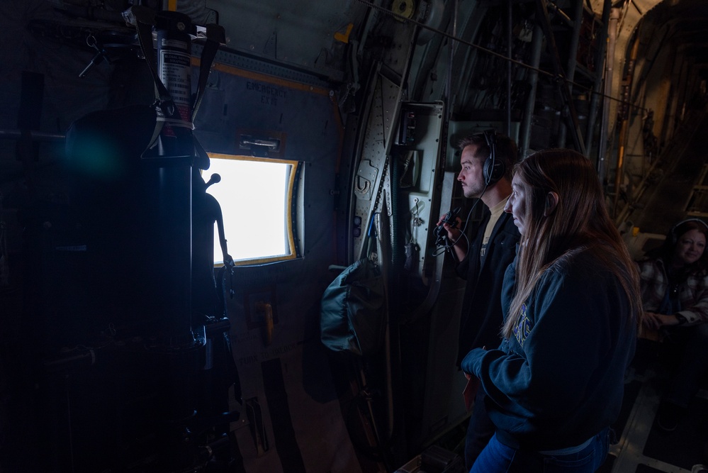 Spouses of members of the 182nd Operations Group fly on a C-130H3