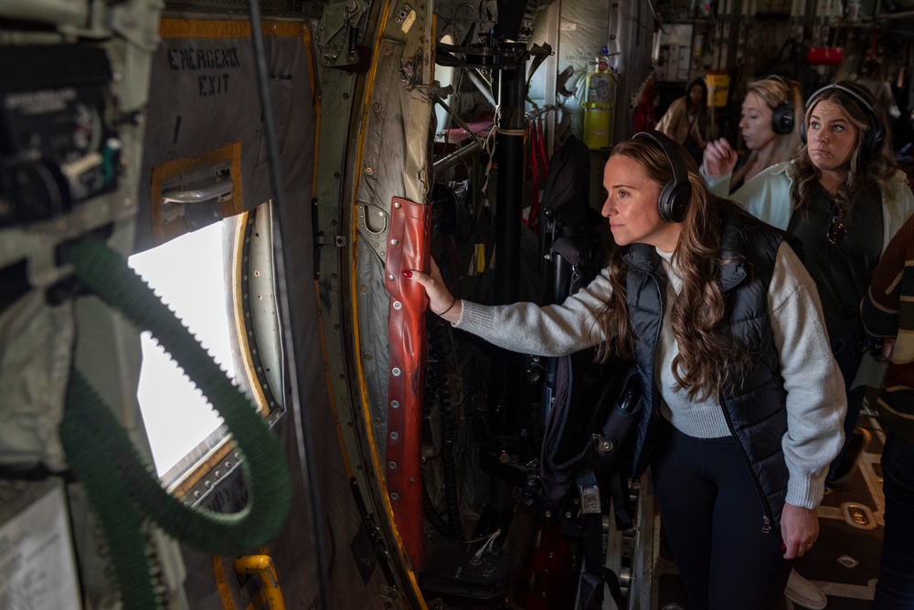Spouses of members of the 182nd Operations Group fly on a C-130H3