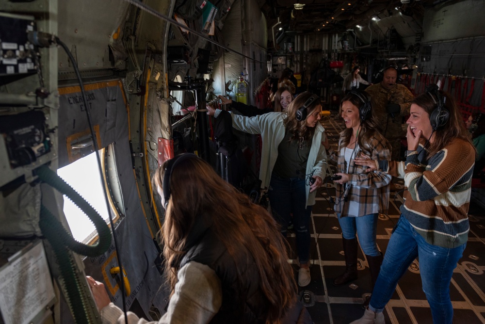 Spouses of members of the 182nd Operations Group fly on a C-130H3