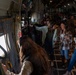 Spouses of members of the 182nd Operations Group fly on a C-130H3