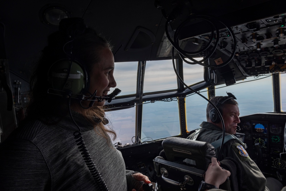 Spouses of members of the 182nd Operations Group fly on a C-130H3
