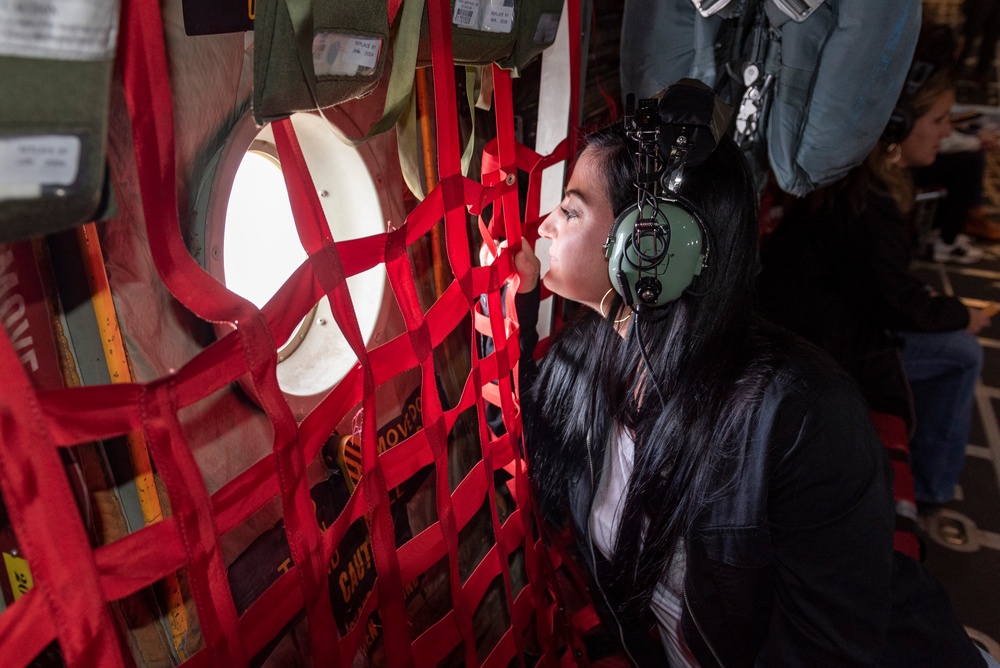 Spouses of members of the 182nd Operations Group fly on a C-130H3