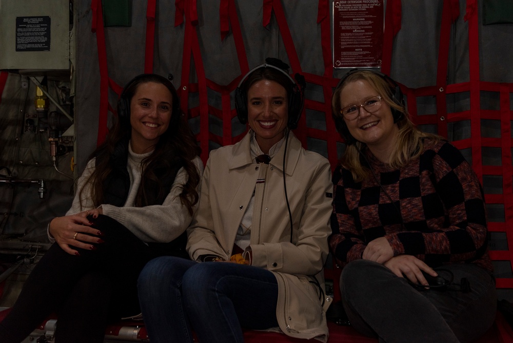 Spouses of members of the 182nd Operations Group fly on a C-130H3