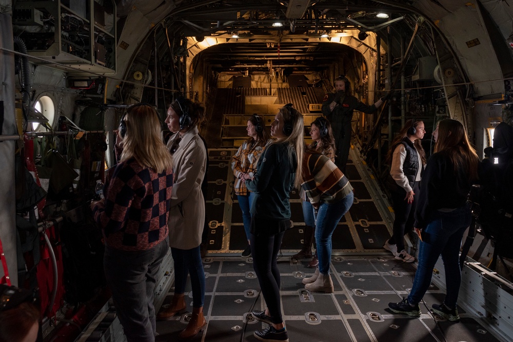 Spouses of members of the 182nd Operations Group fly on a C-130H3
