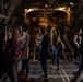 Spouses of members of the 182nd Operations Group fly on a C-130H3