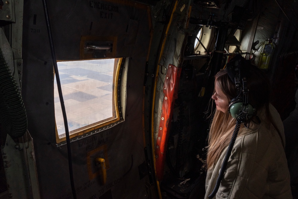 Spouses of members of the 182nd Operations Group fly on a C-130H3