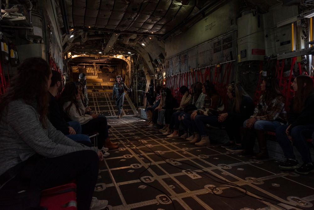 Spouses of members of the 182nd Operations Group fly on a C-130H3