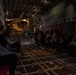 Spouses of members of the 182nd Operations Group fly on a C-130H3