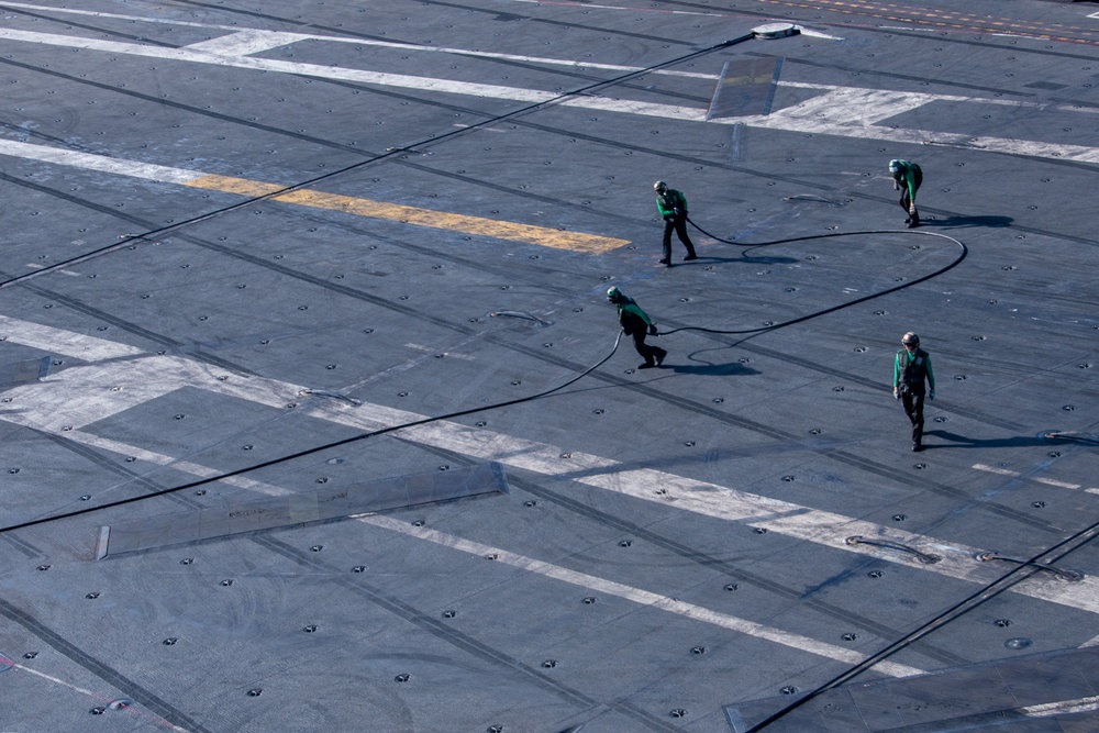 USS Ronald Reagan (CVN 76) conducts flight operations in support of Multi-Large Deck Exercise with USS Carl Vinson (CVN 70) and Japanese Maritime Self-Defense Force Hyuga-class helicopter destroyer JS Hyuga (DDH 181)