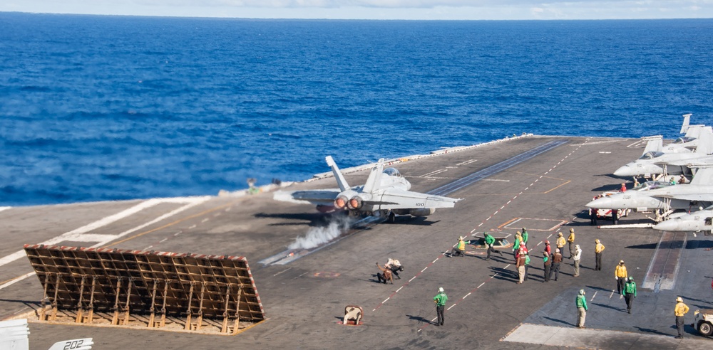 USS Ronald Reagan (CVN 76) conducts flight operations in support of Multi-Large Deck Exercise with USS Carl Vinson (CVN 70) and Japanese Maritime Self-Defense Force Hyuga-class helicopter destroyer JS Hyuga (DDH 181)