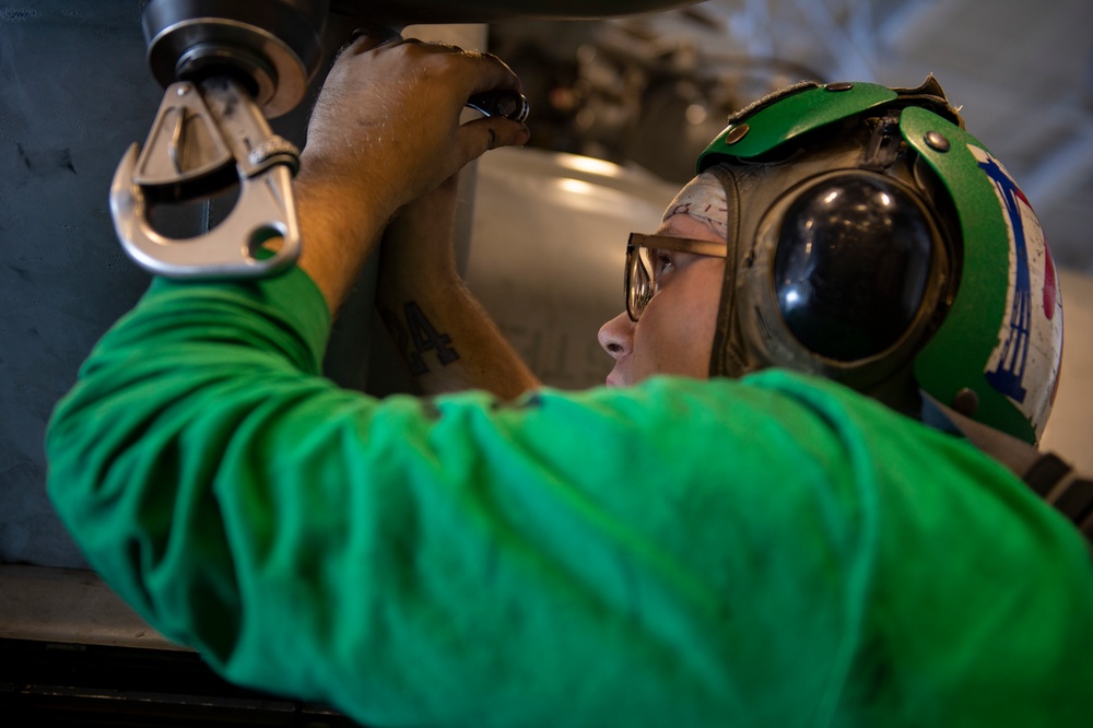 USS Carl Vinson (CVN 70) Sailors Conduct Maintenance In The Hangar Bay