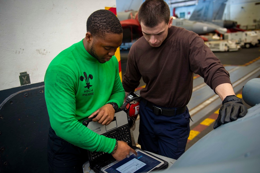 USS Carl Vinson (CVN 70) Sailors Conduct Helicopter Maintenance