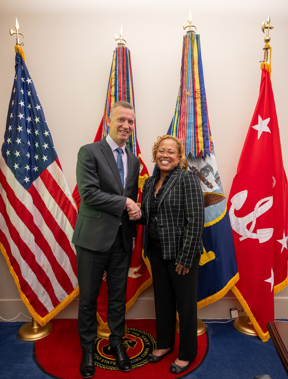 Under Secretary of the Navy administers the oath of office to Ms. Arveice Washington