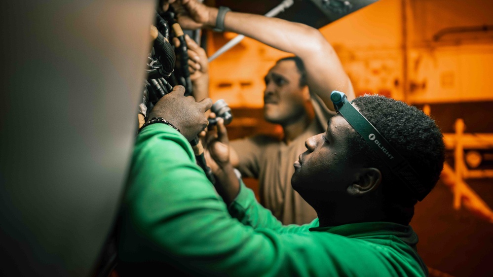 Sailors conduct maintenance aboard USS Carl Vinson