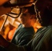 Sailor cleans aircraft aboard USS Carl Vinson (CVN 70)