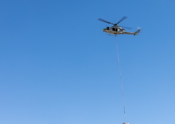 Marine Corps Helicopters Training and Helping | UH-1Y Venoms Airlift Water Tanks to Endangered Bighorn Sheep