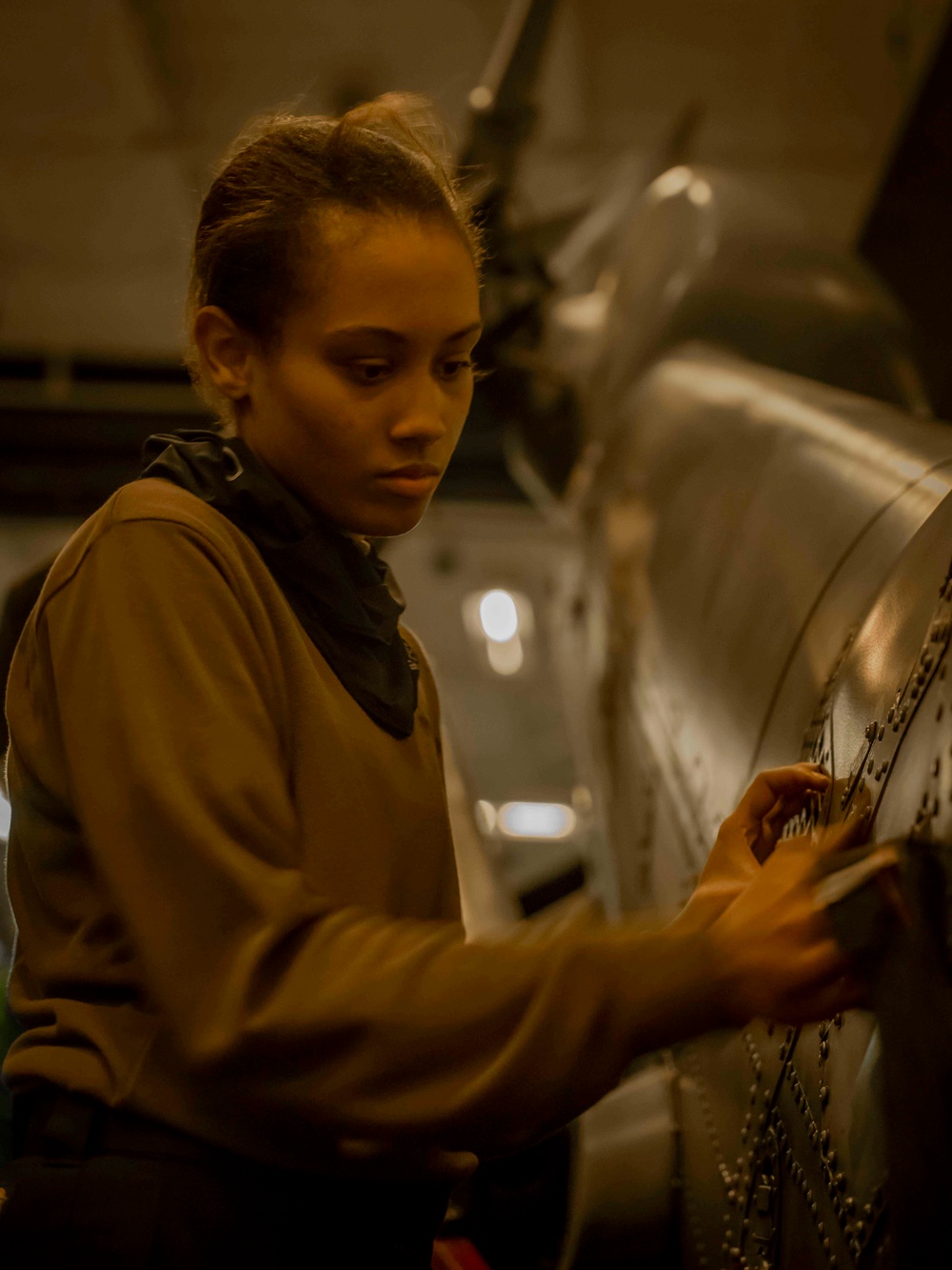 Helicopter Sea Combat Squadron (HSC) 4 Sailors Conduct Aircraft Maintenance in the Pacific Ocean