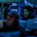 Sailors aboard USS Shoup stand watch in combat information center