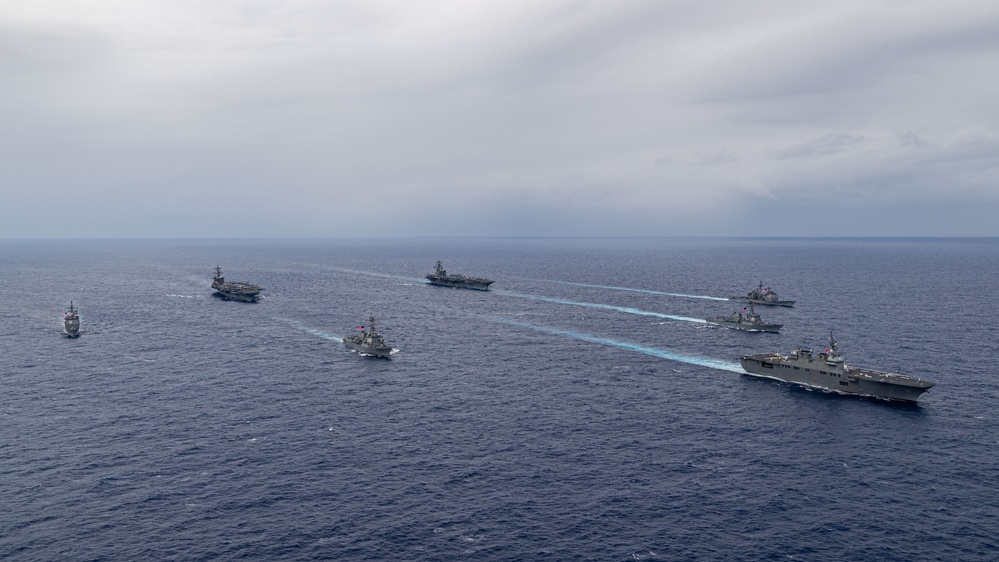 Ronald Reagan and Carl Vinson Carrier Strike Groups steam in formation with Japan Maritime Self-Defense Force (JMSDF) first-in-class helicopter destroyer JS Hyuga (DDH 181) during Multi-Large Deck Exercise