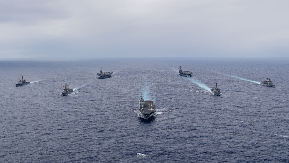 Ronald Reagan and Carl Vinson Carrier Strike Groups steam in formation with Japan Maritime Self-Defense Force (JMSDF) first-in-class helicopter destroyer JS Hyuga (DDH 181) during Multi-Large Deck Exercise