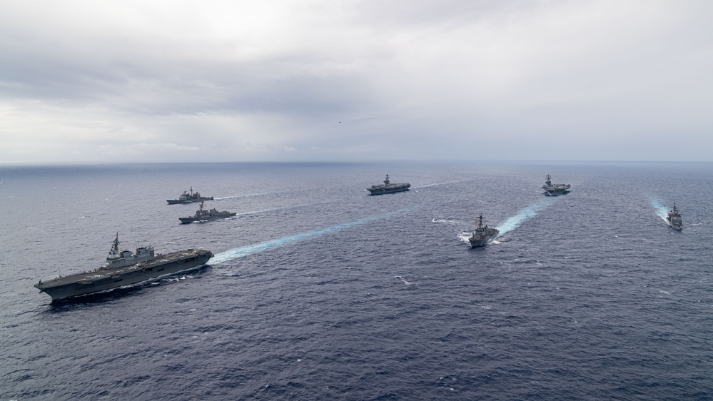 Ronald Reagan and Carl Vinson Carrier Strike Groups steam in formation with Japan Maritime Self-Defense Force (JMSDF) first-in-class helicopter destroyer JS Hyuga (DDH 181) during Multi-Large Deck Exercise