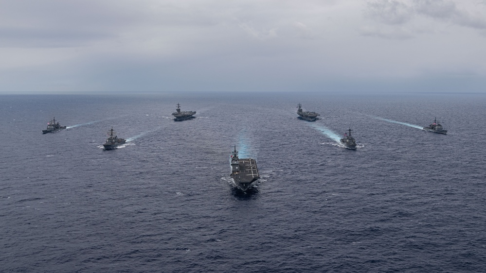 Ronald Reagan and Carl Vinson Carrier Strike Groups steam in formation with Japan Maritime Self-Defense Force (JMSDF) first-in-class helicopter destroyer JS Hyuga (DDH 181) during Multi-Large Deck Exercise