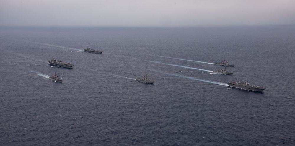 Ronald Reagan and Carl Vinson Carrier Strike Groups steam in formation with Japan Maritime Self-Defense Force (JMSDF) first-in-class helicopter destroyer JS Hyuga (DDH 181) during Multi-Large Deck Exercise