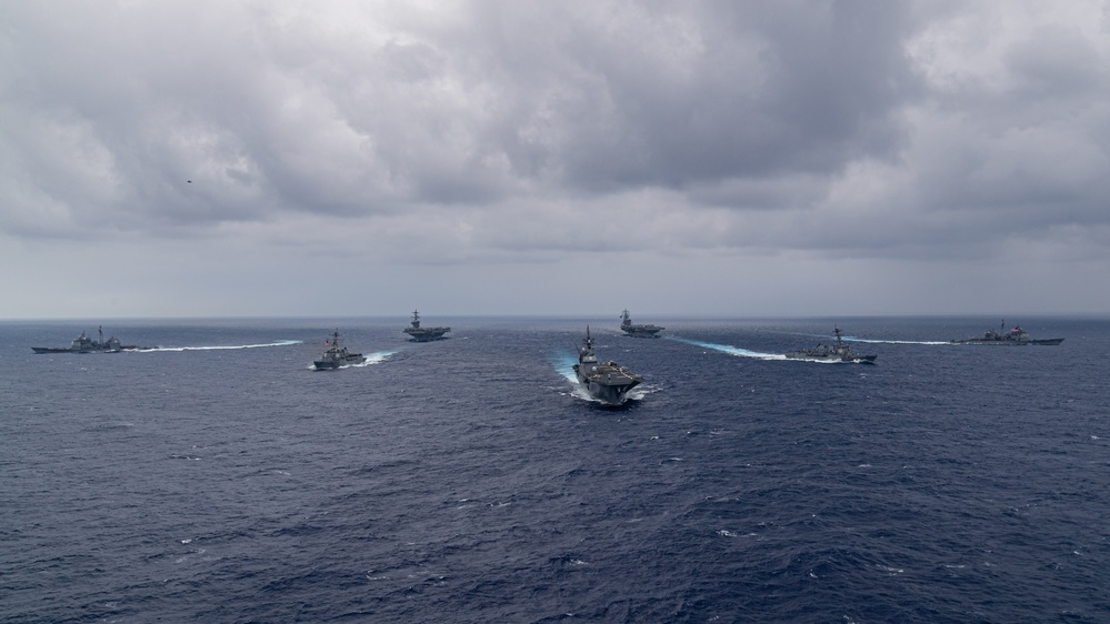 Ronald Reagan and Carl Vinson Carrier Strike Groups steam in formation with Japan Maritime Self-Defense Force (JMSDF) first-in-class helicopter destroyer JS Hyuga (DDH 181) during Multi-Large Deck Exercise