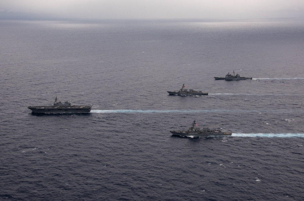 Ronald Reagan and Carl Vinson Carrier Strike Groups steam in formation with Japan Maritime Self-Defense Force (JMSDF) first-in-class helicopter destroyer JS Hyuga (DDH 181) during Multi-Large Deck Exercise