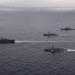 Ronald Reagan and Carl Vinson Carrier Strike Groups steam in formation with Japan Maritime Self-Defense Force (JMSDF) first-in-class helicopter destroyer JS Hyuga (DDH 181) during Multi-Large Deck Exercise
